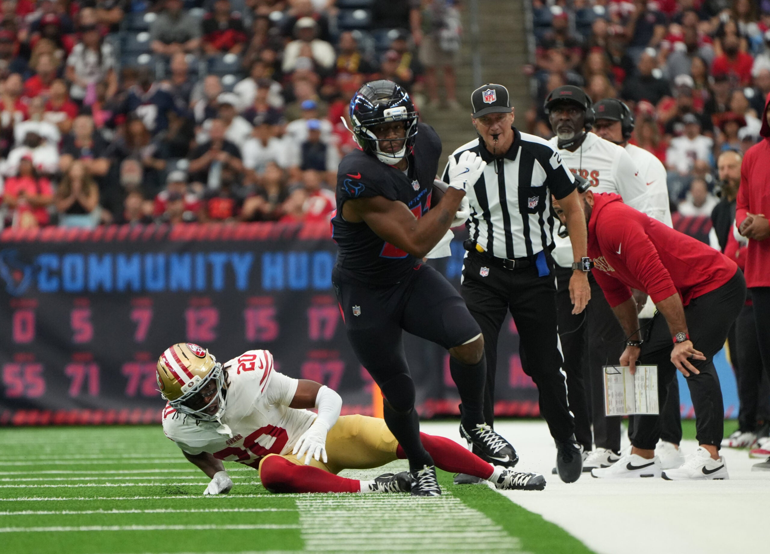 Oct 26, 2025; Houston, Texas, USA; Houston Texans running back Nick Chubb (21) runs out of bounds after a tackle attempt by San Francisco 49ers cornerback Upton Stout (20) during the first quarter at NRG Stadium.