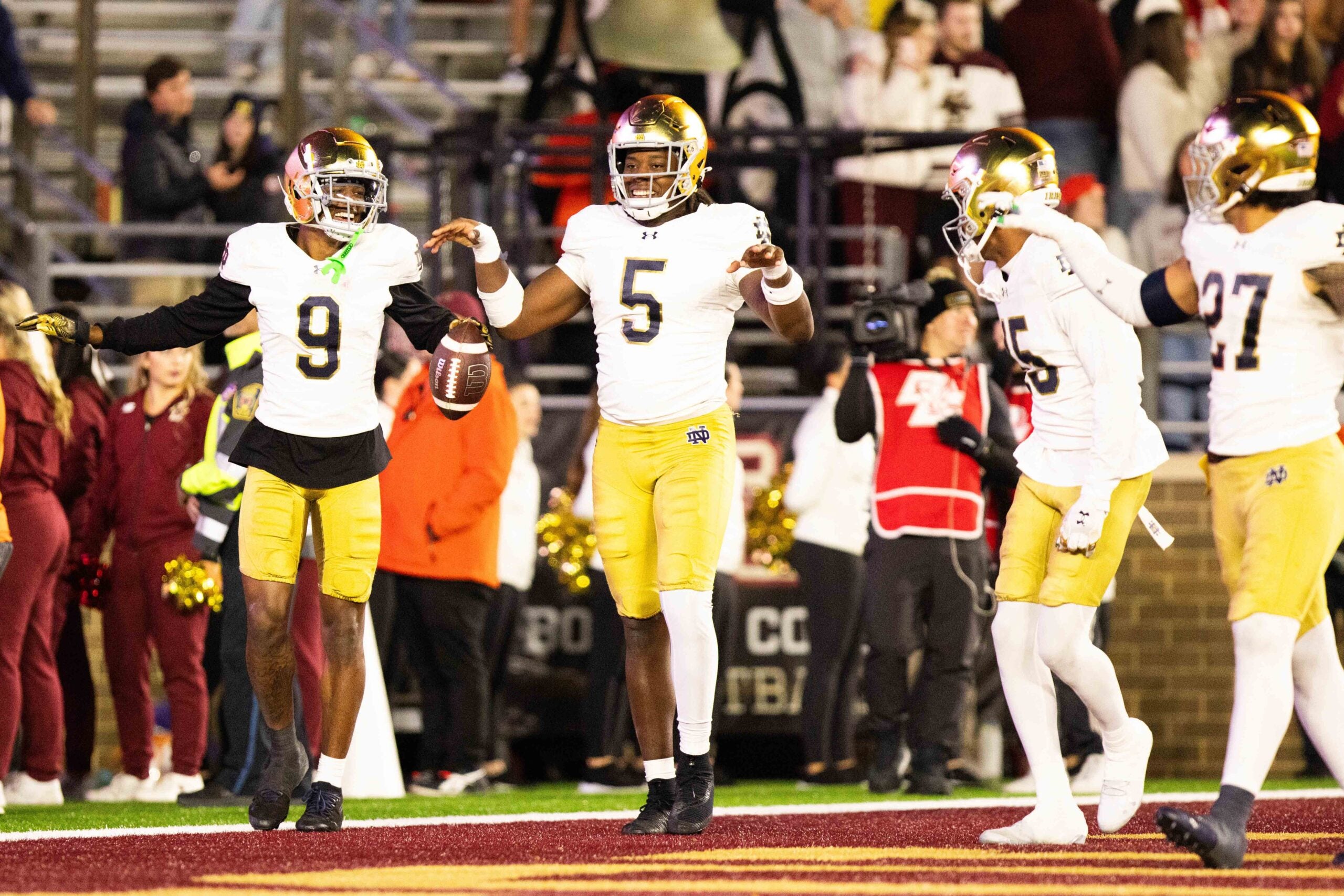 Nov 1, 2025; Chestnut Hill, Massachusetts, USA; Notre Dame safety Tae Johnson (9) and Notre Dame Fighting Irish defensive lineman Boubacar Traore (5) celebrate an interception in the fourth quarter against the Boston College Eagles at Alumni Stadium.