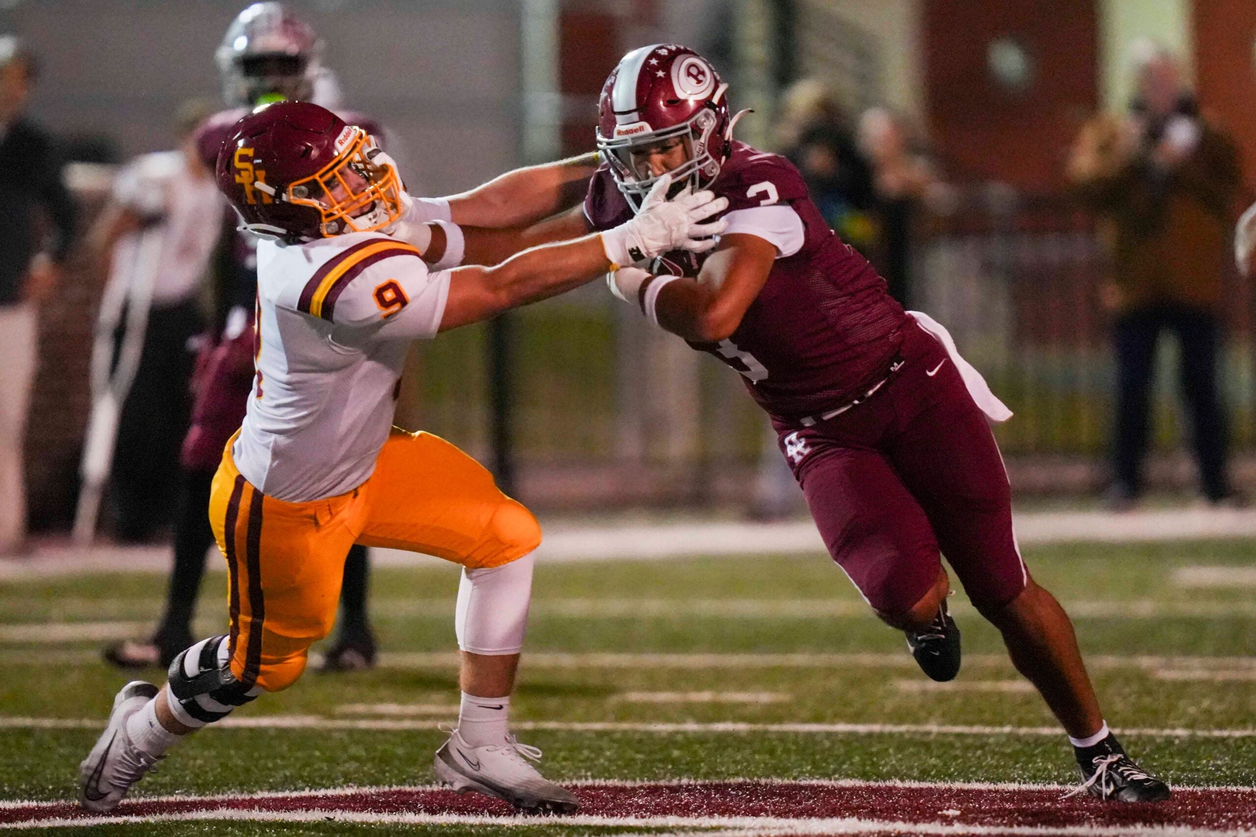 Science Hill's Hayden Smith (9) tackles Oak Ridge's Malik Howard (3) during a TSSAA football play-off game between Oak Ridge and Science Hill in Oak Ridge, Tenn., on Nov. 6, 2025.