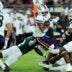 Nov 6, 2025; Tampa, Florida, USA; UTSA Roadrunners running back Will Henderson III (23) runs with the ball as South Florida Bulls cornerback Tavin Ward (2) tackles during the first half at Raymond James Stadium.