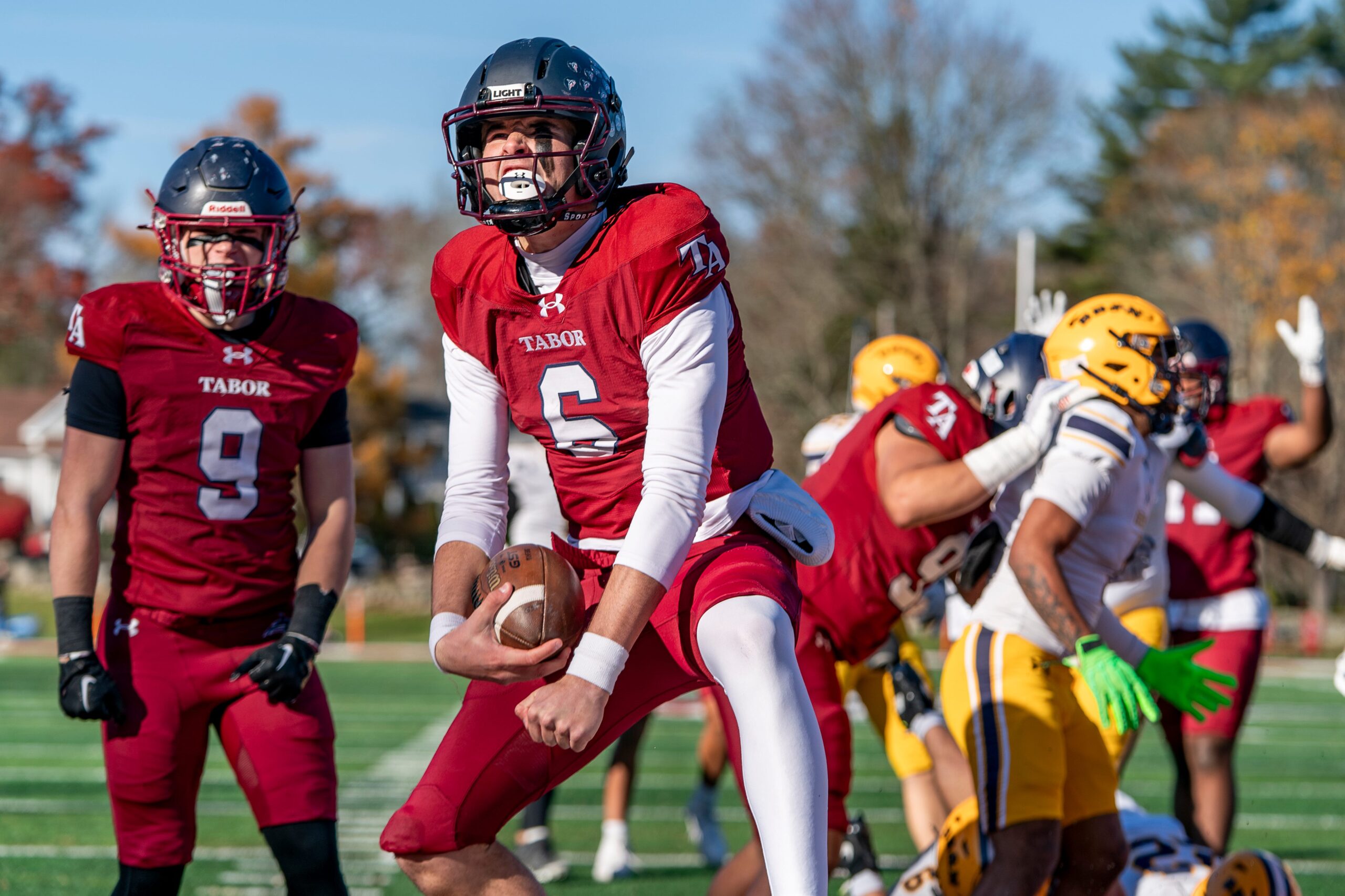 Tabor Academy quarterback Peter Bourque celebrates after scoring a touchdown in the opening drive.
