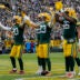 Nov 23, 2025; Green Bay, Wisconsin, USA; Green Bay Packers safeties Javon Bullard (20), Evan Williams (33), and Xavier McKinney (29) and linebacker Edgerrin Cooper (56) lead Packers fans in a mock ÒSkolÓ chant after Williams intercepts a pass against the Minnesota Viking in the game at Lambeau Field.
