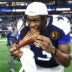 Nov 27, 2025; Arlington, Texas, USA; Dallas Cowboys wide receiver George Pickens (3) celebrates by eating turkey after the game against the Kansas City Chiefs at AT&T Stadium.