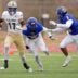 Choctaw's Titus Hawk runs after a catch as Stillwater's Brandon Mitchell (8) and Braylen Taylor (5) defend during the Class 6A II semifinal playoff game between Choctaw and Stillwater at Edmond North High School in Edmond, Okla., Friday Nov. 28, 2025.