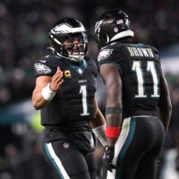 Nov 28, 2025; Philadelphia, Pennsylvania, USA; Philadelphia Eagles quarterback Jalen Hurts (1) and wide receiver A.J. Brown (11) celebrate their touchdown connection against the Chicago Bears at Lincoln Financial Field.