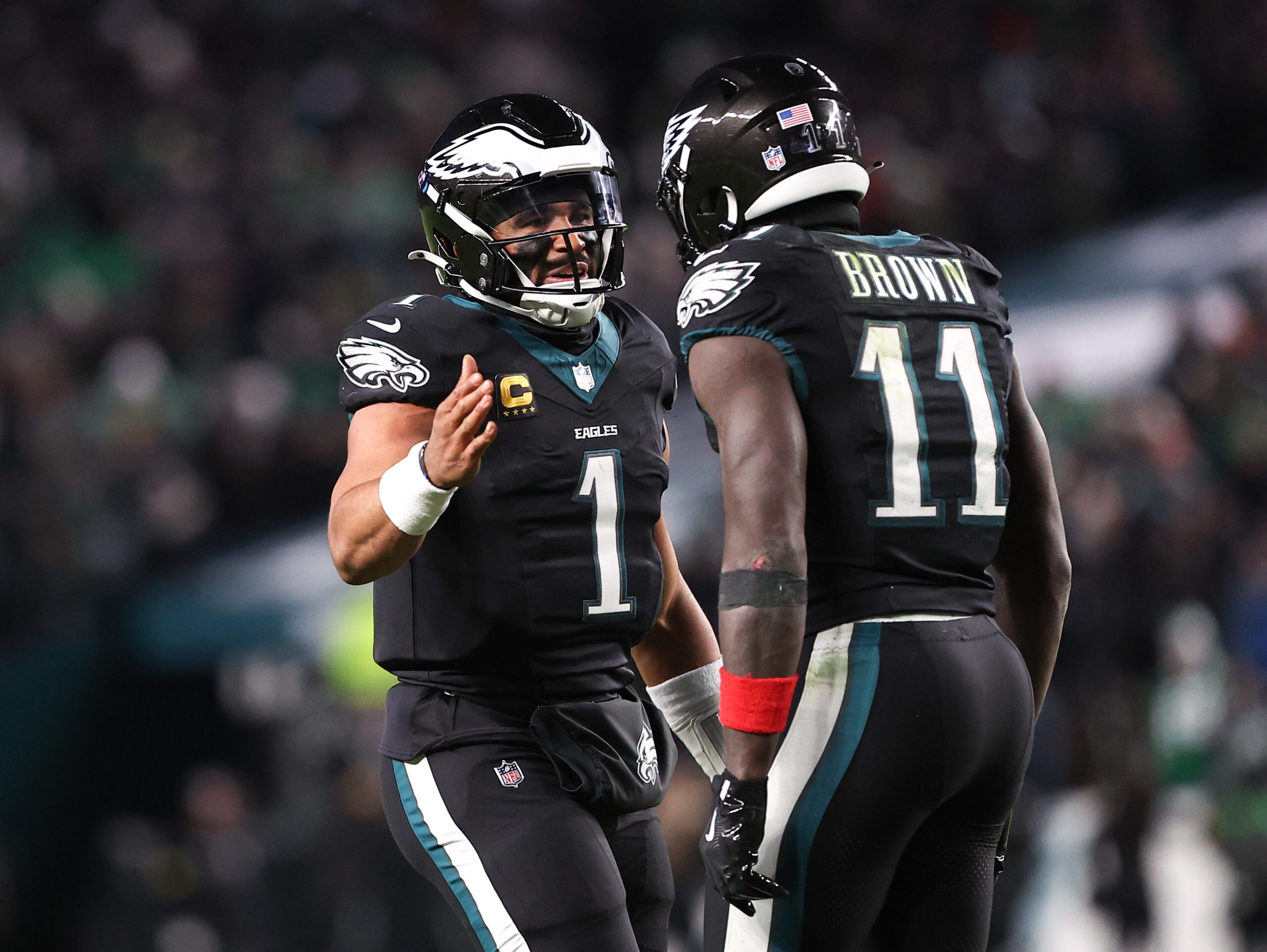 Nov 28, 2025; Philadelphia, Pennsylvania, USA; Philadelphia Eagles quarterback Jalen Hurts (1) and wide receiver A.J. Brown (11) celebrate their touchdown connection against the Chicago Bears at Lincoln Financial Field.