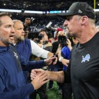 Detroit Lions head coach Dan Campbell shakes hands with Dallas Cowboys head coach Brian Schottenheimer after 44-30 win at Ford Field in Detroit on Thursday, Dec. 4, 2025.