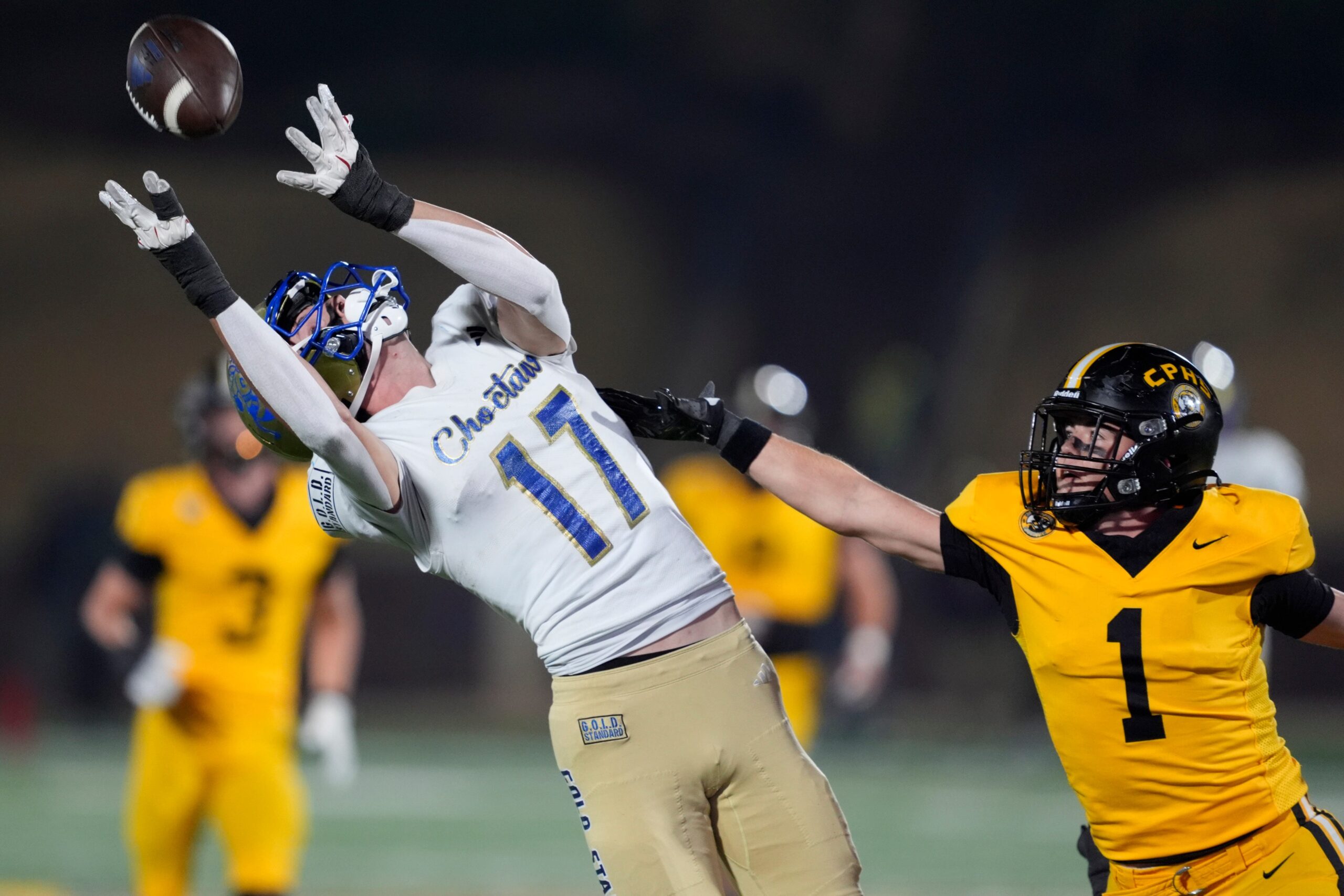 Choctaw's Titus Hawk catches a pass for a touchdown beside Alex Dudley of Sand Springs during the Class 6A-II high school football championship game between Choctaw and Sand Springs at Chad Richison Stadium in Edmond, Okla., Friday, Dec. 5, 2025.