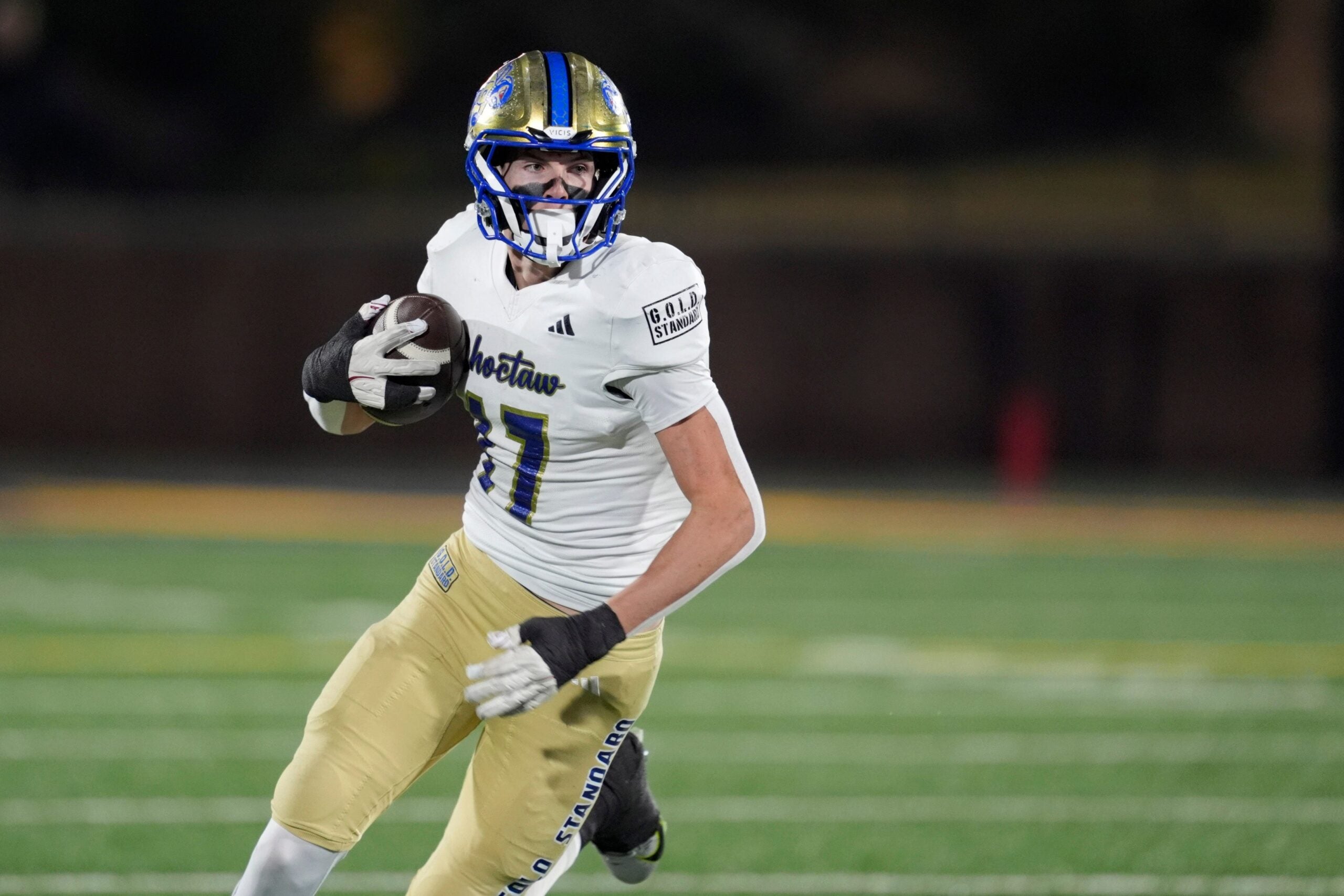 Choctaw's Titus Hawk runs after a reception during the Class 6A-II high school football championship game between Choctaw and Sand Springs at Chad Richison Stadium in Edmond, Okla., Friday, Dec. 5, 2025.