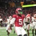 Dec 6, 2025; Atlanta, GA, USA; Alabama Crimson Tide wide receiver Germie Bernard (5) scores a touchdown during the fourth quarter against the Georgia Bulldogs during the 2025 SEC Championship game at Mercedes-Benz Stadium.