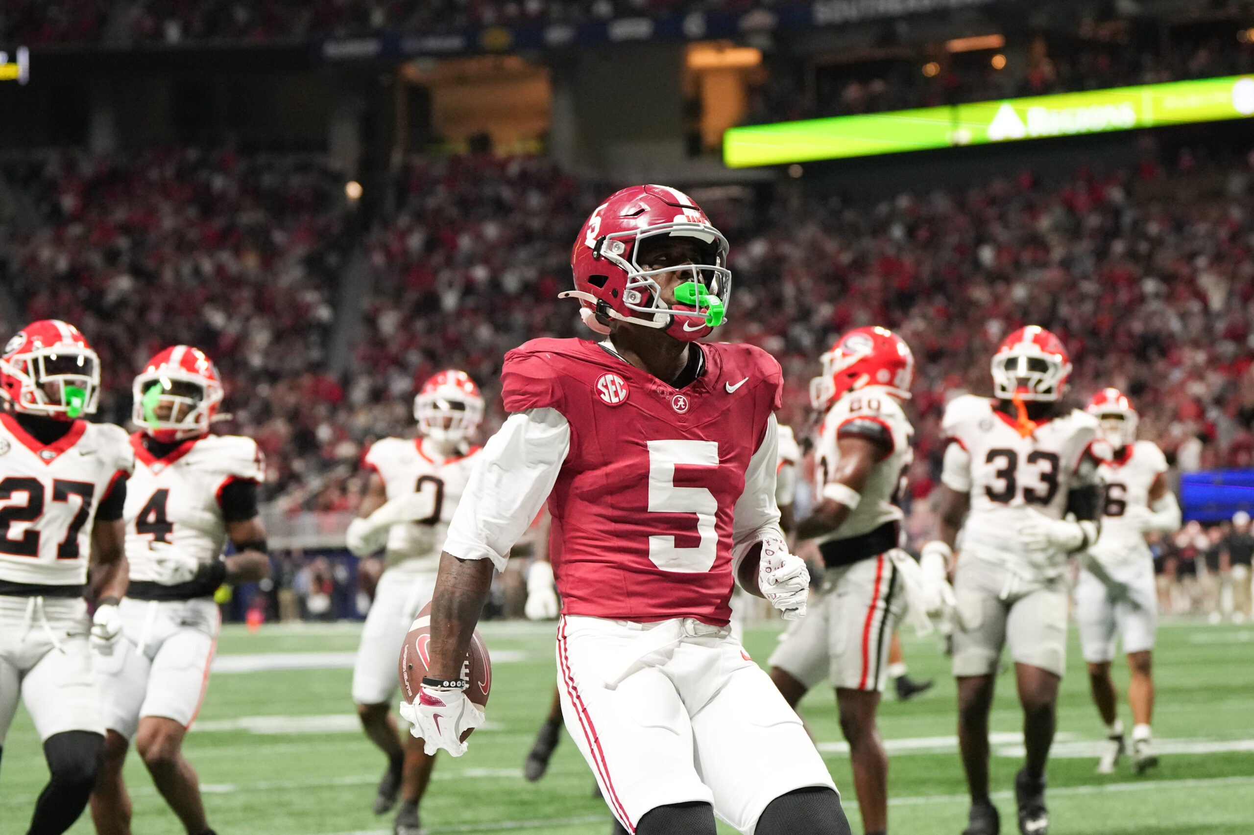 Dec 6, 2025; Atlanta, GA, USA; Alabama Crimson Tide wide receiver Germie Bernard (5) scores a touchdown during the fourth quarter against the Georgia Bulldogs during the 2025 SEC Championship game at Mercedes-Benz Stadium.