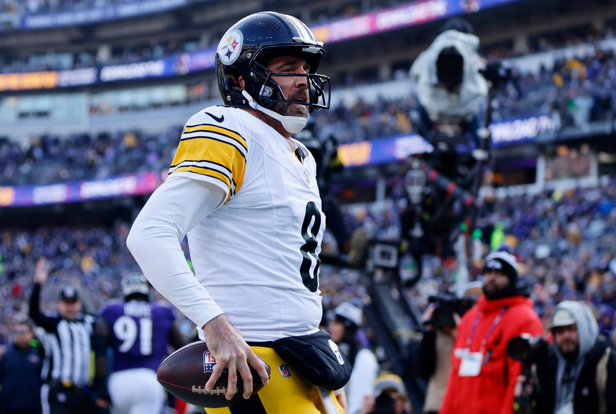 Dec 7, 2025; Baltimore, Maryland, USA; Pittsburgh Steelers quarterback Aaron Rodgers (8) reacts after scoring a touchdown against the Baltimore Ravens during the first half at M&T Bank Stadium.