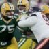 Green Bay Packers' Sean Rhyan (75) blocks Chicago Bears defensive tackle Andrew Billings (97) while providing pass protection during the first quarter of their game Sunday, December 7, 2025 at Lambeau Field in Green Bay, Wisconsin.