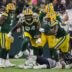 Green Bay Packers defensive end Karl Brooks (94) reacts after tackling Chicago Bears wide receiver DJ Moore (2) for a loss on Sunday, December 7, 2025, at Lambeau Field in Green Bay, Wis. The Packers won the game, 28-21.