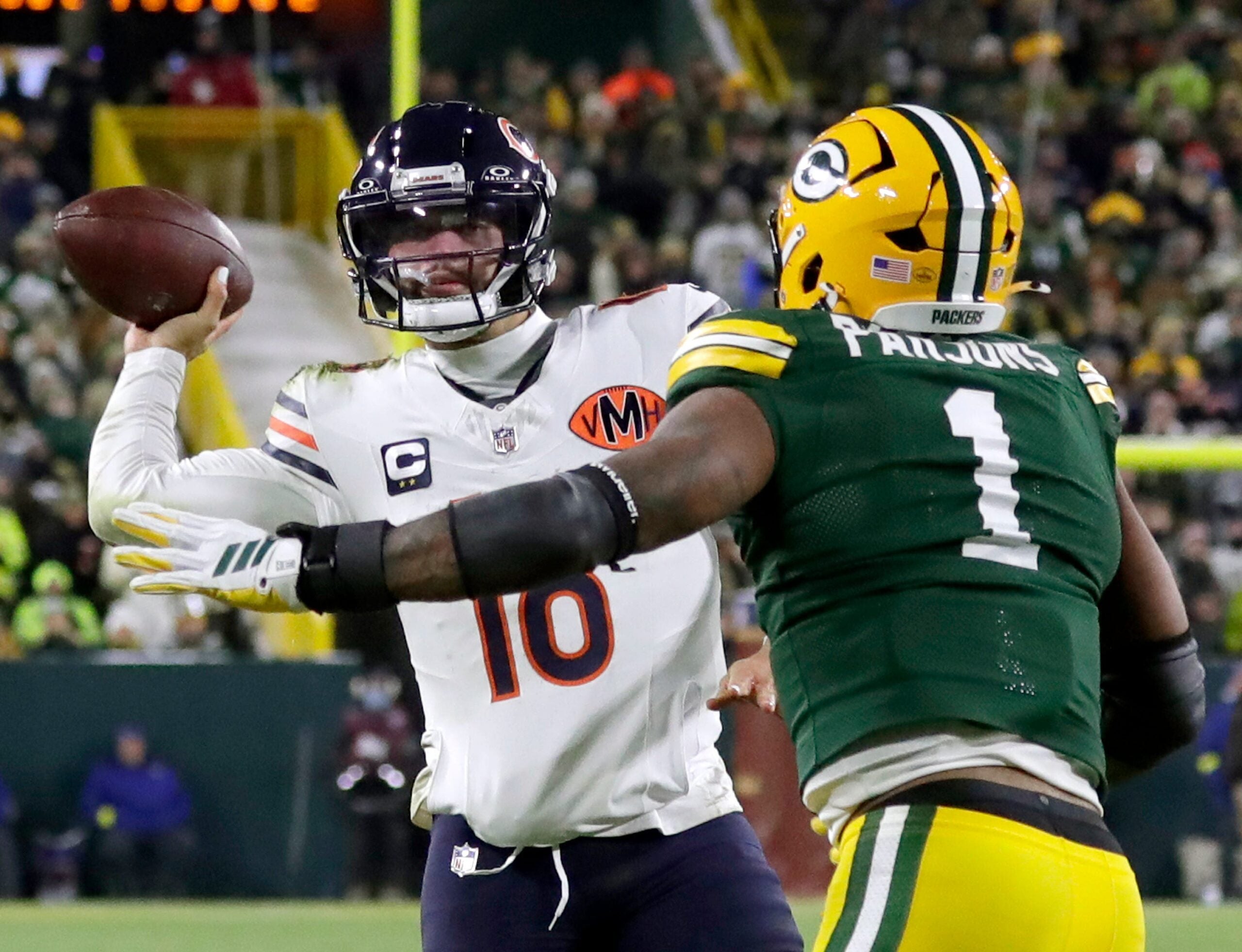 Green Bay Packers defensive end Micah Parsons (1) pressures Chicago Bears quarterback Caleb Williams (18) on Sunday, December 7, 2025, at Lambeau Field in Green Bay, Wis. The Packers defeated the Bears 28-21.