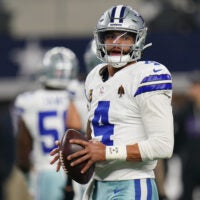 Dec 14, 2025; Arlington, Texas, USA; Dallas Cowboys quarterback Dak Prescott (4) warms up before a game against the Minnesota Vikings at AT&T Stadium.
