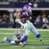 Dec 14, 2025; Arlington, Texas, USA; Minnesota Vikings tight end T.J. Hockenson (87) is tackled by Dallas Cowboys linebacker Demarvion Overshown (0) during the second half at AT&T Stadium.