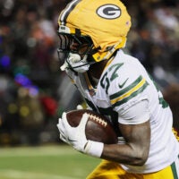 Dec 20, 2025; Chicago, Illinois, USA; Green Bay Packers wide receiver Romeo Doubs (87) runs for a touchdown after catching a pass thrown by quarterback Malik Willis (not pictured) against the Chicago Bears during the third quarter at Soldier Field.