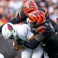 Cincinnati Bengals defensive tackle T.J. Slaton Jr. (98) pulls down Arizona Cardinals quarterback Jacoby Brissett (7) in the third quarter of the NFL Week 17 game between the Cincinnati Bengals and the Arizona Cardinals at Paycor Stadium in Downtown Cincinnati on Sunday, Dec. 28, 2025. The Bengals won 37-14.