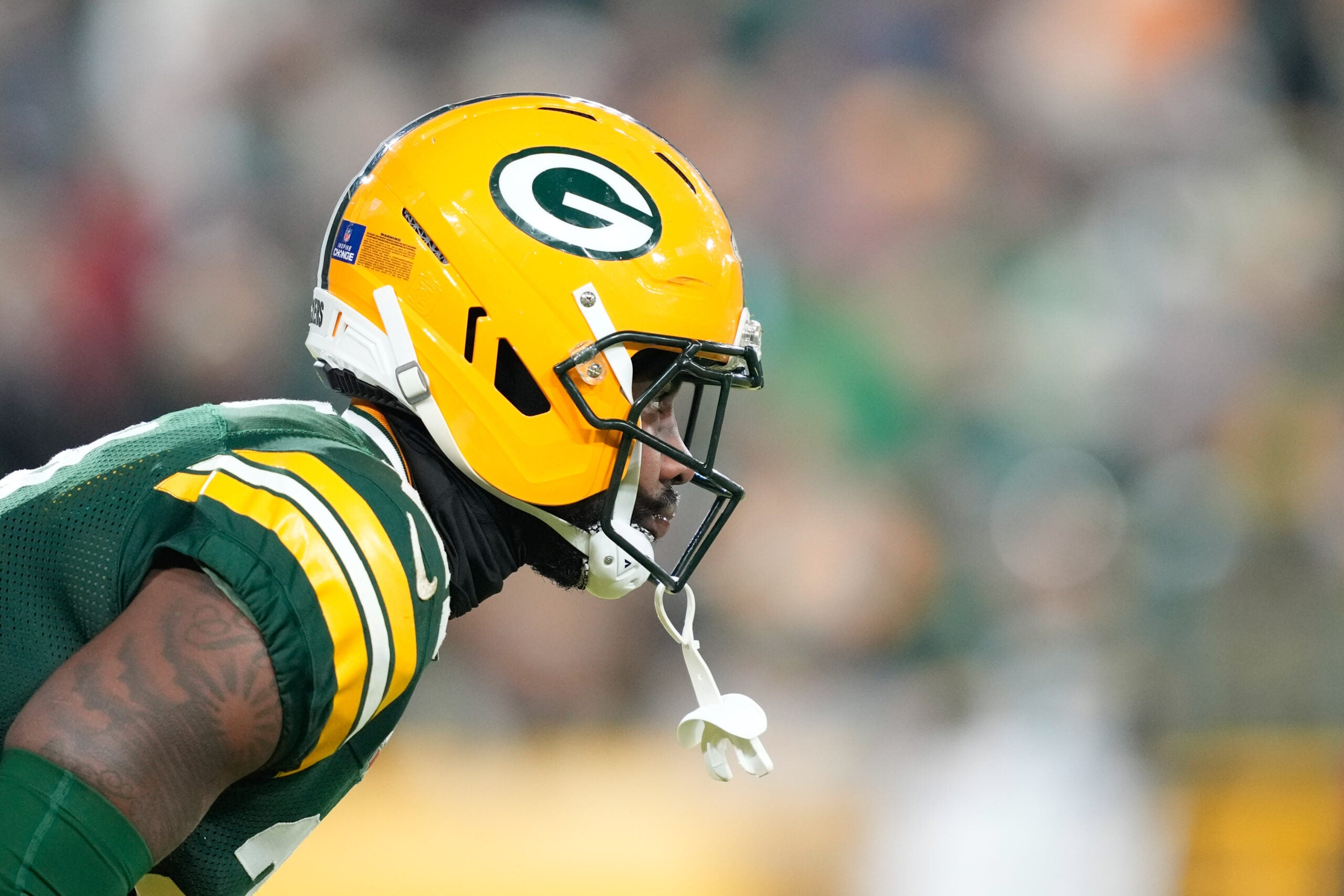 Dec 27, 2025; Green Bay, Wisconsin, USA; Green Bay Packers cornerback Nate Hobbs (21) waits for the kickoff return during the second quarter against the Baltimore Ravens at Lambeau Field.