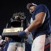 Jan 2, 2026; Memphis, TN, USA; Navy Midshipmen defensive lineman Landon Robinson (96) reacts while holding the Liberty Bowl trophy after defeating the Cincinnati Bearcats in the Liberty Bowl at Simmons Bank Liberty Stadium.