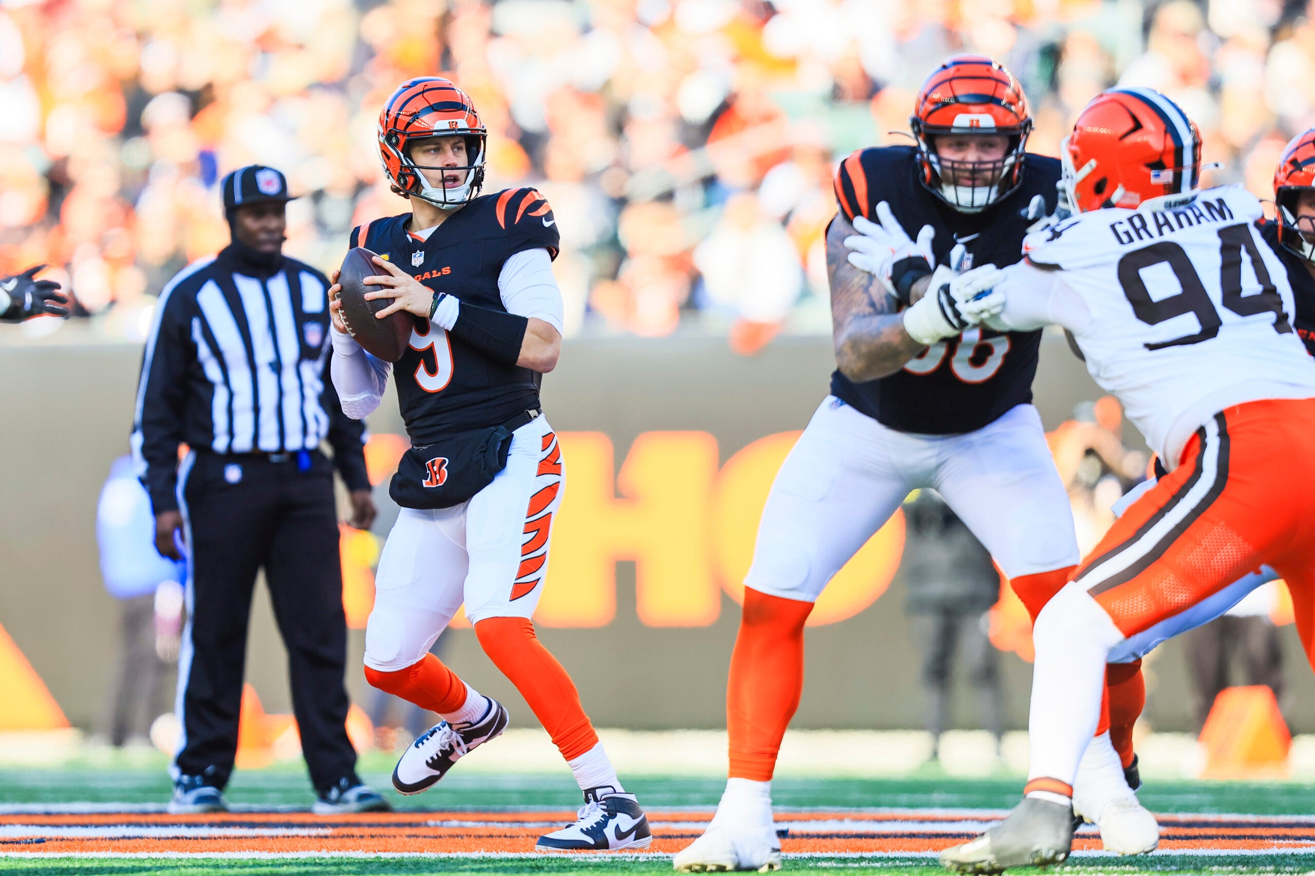 Jan 4, 2026; Cincinnati, Ohio, USA; Cincinnati Bengals quarterback Joe Burrow (9) looks to pass against the Cleveland Browns during the second quarter at Paycor Stadium.