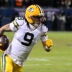 Jan 10, 2026; Chicago, IL, USA; Green Bay Packers wide receiver Christian Watson (9) runs after the catch against the Chicago Bears during the first half of an NFC Wild Card Round game at Soldier Field.
