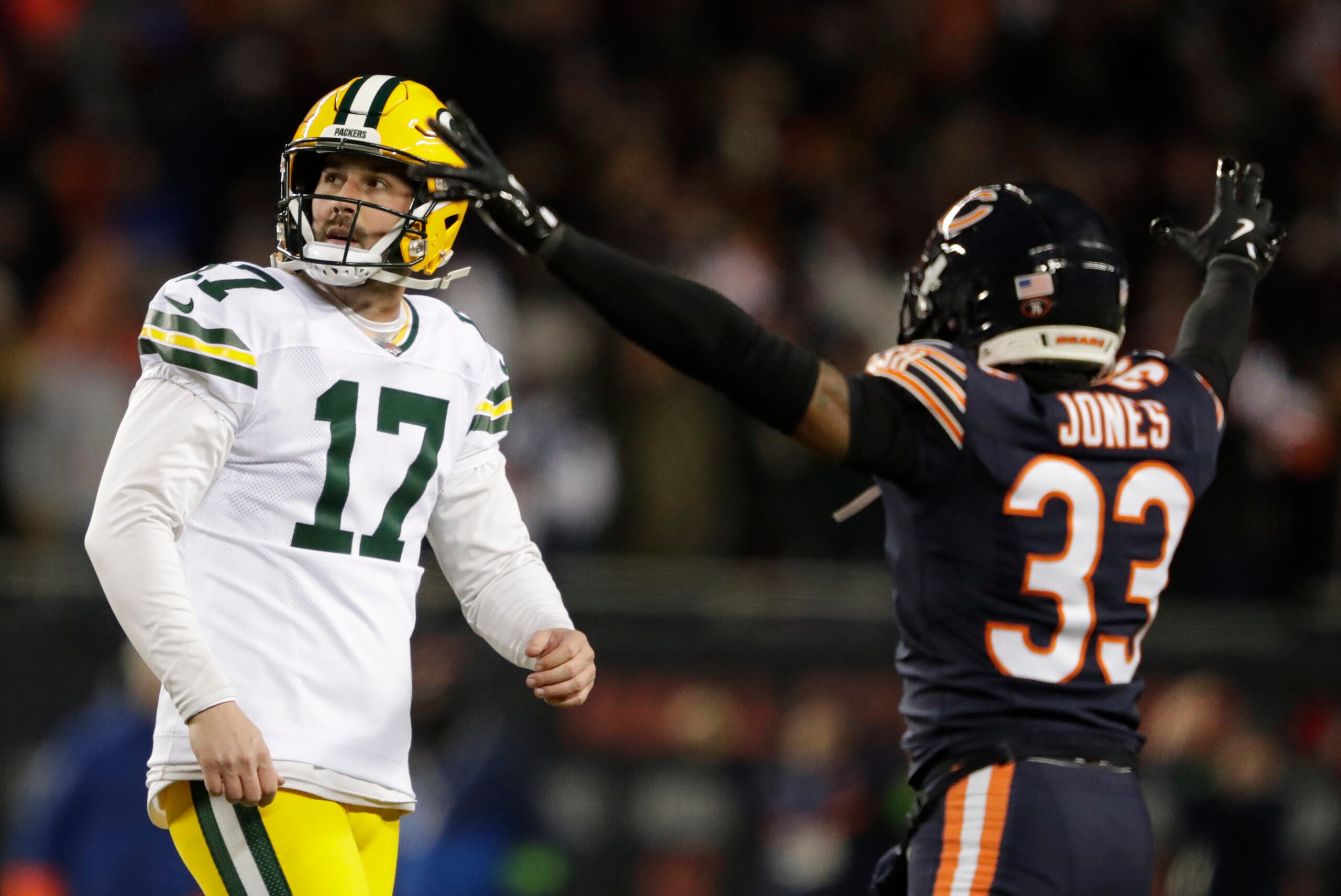 Jan 10, 2026; Chicago, IL, USA; Green Bay Packers place kicker Brandon McManus (17) reacts to missing a field goal late in the fourth quarter as Chicago Bears cornerback Jaylon Jones (33) celebrates in an NFC Wild Card Round game at Soldier Field.