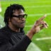 Jan 8, 2026; Glendale, AZ, USA; Miami Hurricanes former player Michael Irvin looks on in the closing seconds of the game against the Mississippi Rebels during the 2026 Fiesta Bowl and semifinal game of the College Football Playoff at State Farm Stadium.
