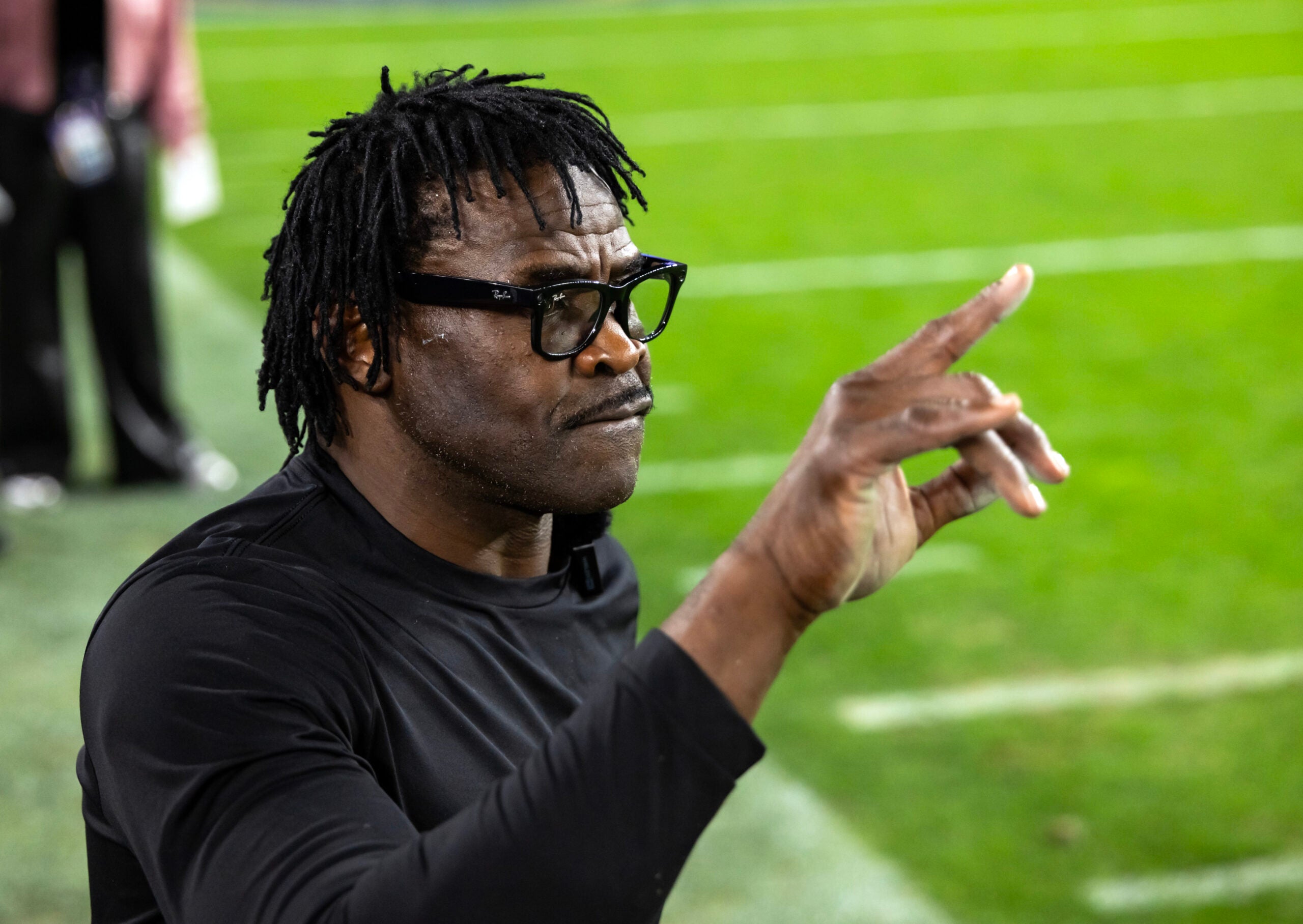 Jan 8, 2026; Glendale, AZ, USA; Miami Hurricanes former player Michael Irvin looks on in the closing seconds of the game against the Mississippi Rebels during the 2026 Fiesta Bowl and semifinal game of the College Football Playoff at State Farm Stadium.