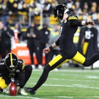 Jan 12, 2026; Pittsburgh, PA, USA; Pittsburgh Steelers place kicker Chris Boswell (9) kicks a field goal out of the hold by punter Corliss Waitman (3) during the first half of an AFC Wild Card Round game against the Houston Texans at Acrisure Stadium.