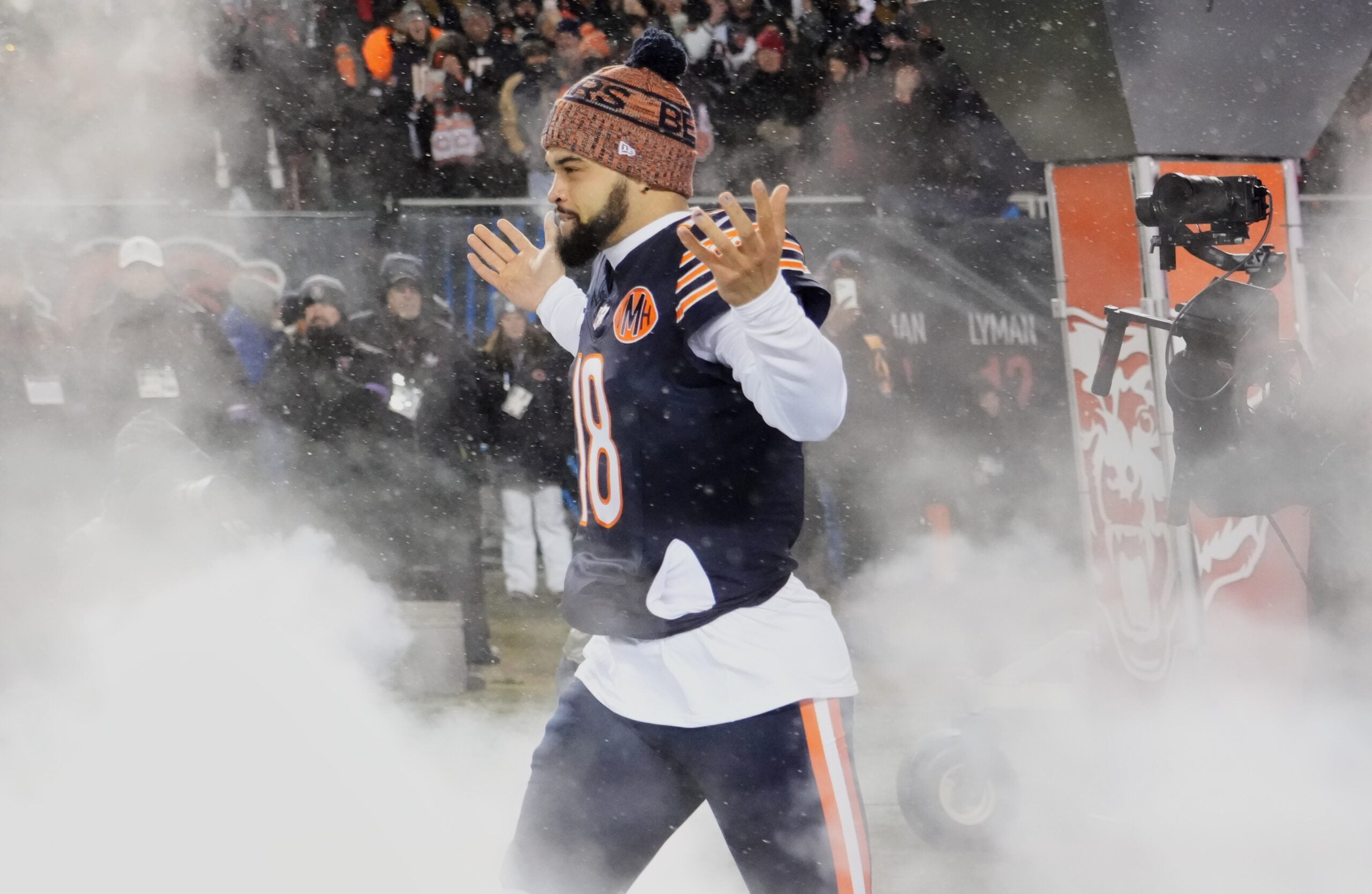 Jan 18, 2026; Chicago, IL, USA; Chicago Bears quarterback Caleb Williams (18) runs onto the field during player introductions before an NFC Divisional Round game against the Los Angeles Rams at Soldier Field.