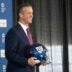 New Giants Head Coach John Harbaugh holds up a New York Giants helmet during a press conference welcoming Harbaugh at the Quest Diagnostics Training Center in East Rutherford on Tuesday, Jan. 20, 2025.