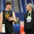 Feb 28, 2026; Indianapolis, IN, USA; Penn State quarterback Drew Allar (QB02) speaks with Pittsburgh Steelers quarterbacks coach Tim Berbenich during the NFL Scouting Combine at Lucas Oil Stadium.