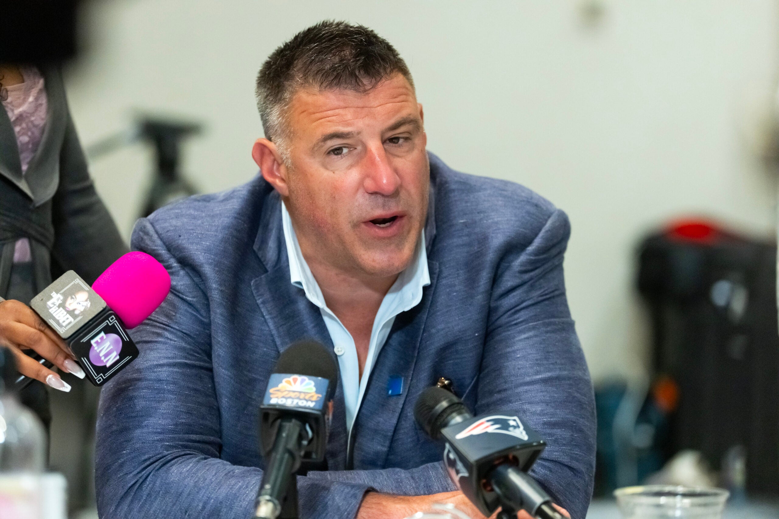 Mar 31, 2026; Phoenix, AZ, USA; New England Patriots head coach Mike Vrabel speaks to reporters in the media during the 2026 NFL Annual League Meeting at the Arizona Biltmore.