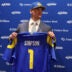 Apr 24, 2026; Inglewood, CA, USA; Los Angeles Rams first-round draft pick Ty Simpson poses with his jersey during a press conference at Code Next at Hollywood Park.