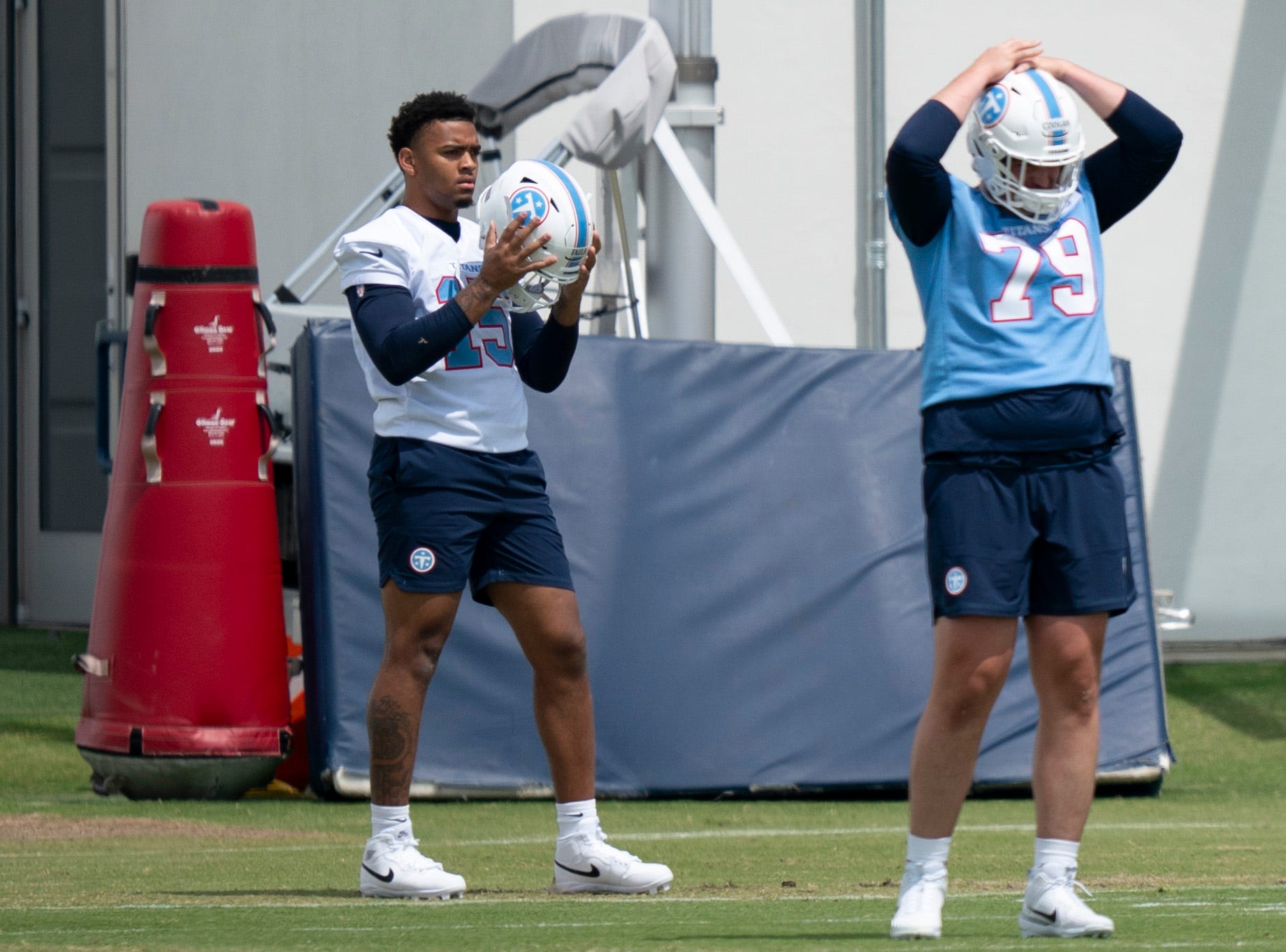 Tennessee Titans first round pick defensive end Keldric Faulk (15) (31st overall) goes through stretching drills with sixth round pick center Pat Coogan (79) during the Titans Rookie Camp Day 1 at Vanderbilt Health Football Center in Nashville, Tenn., Friday, May 1, 2026.