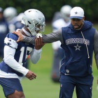 May 1, 2026; Frisco, TX, USA; Dallas Cowboys cornerback Caleb Downs (18) is coached through a drill with defensive coordinator Christian Parker at the Ford Center at the Star Training Facility in Frisco, Texas.