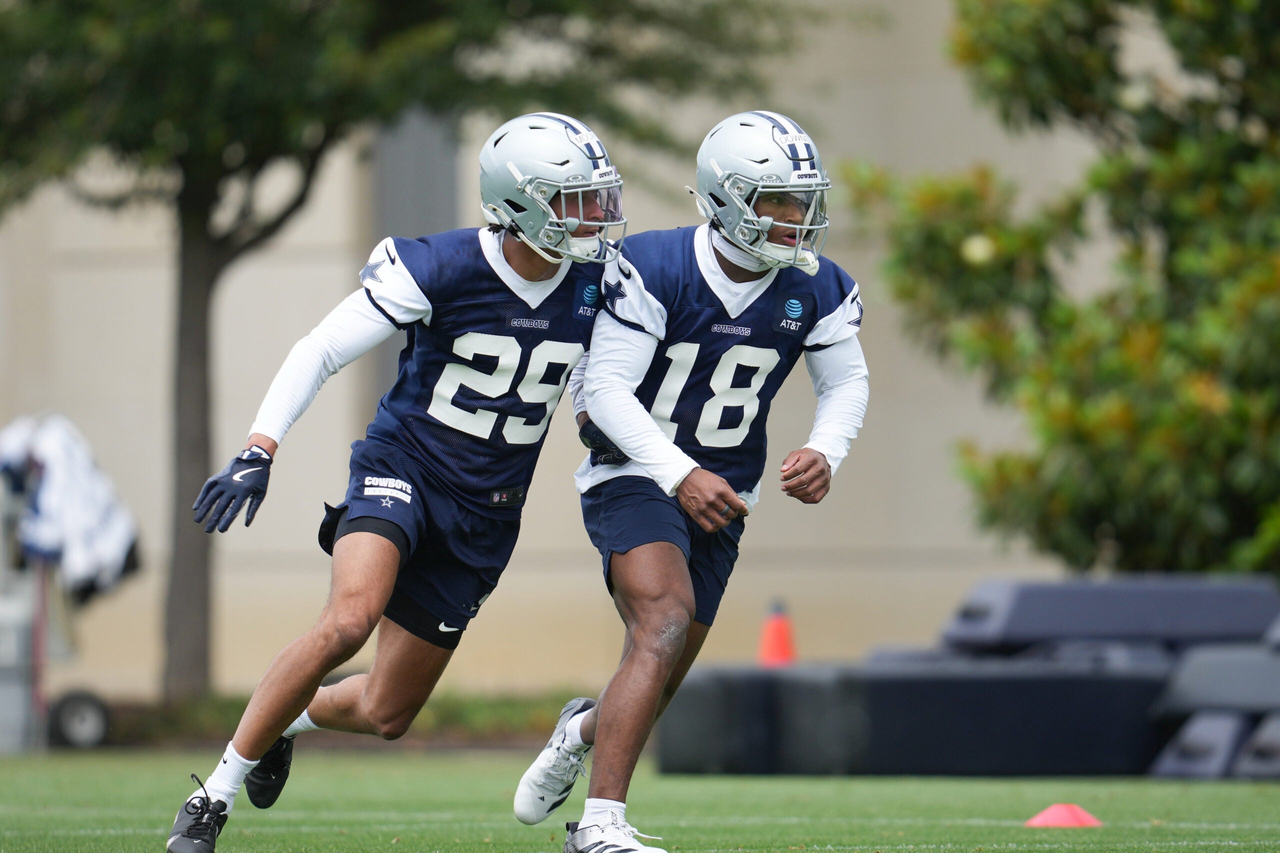 May 1, 2026; Frisco, TX, USA; Dallas Cowboys cornerback Devin Moore (29) and Dallas Cowboys safety Caleb Downs (18) go through a drill during practice at the Ford Center at the Star Training Facility in Frisco, Texas.