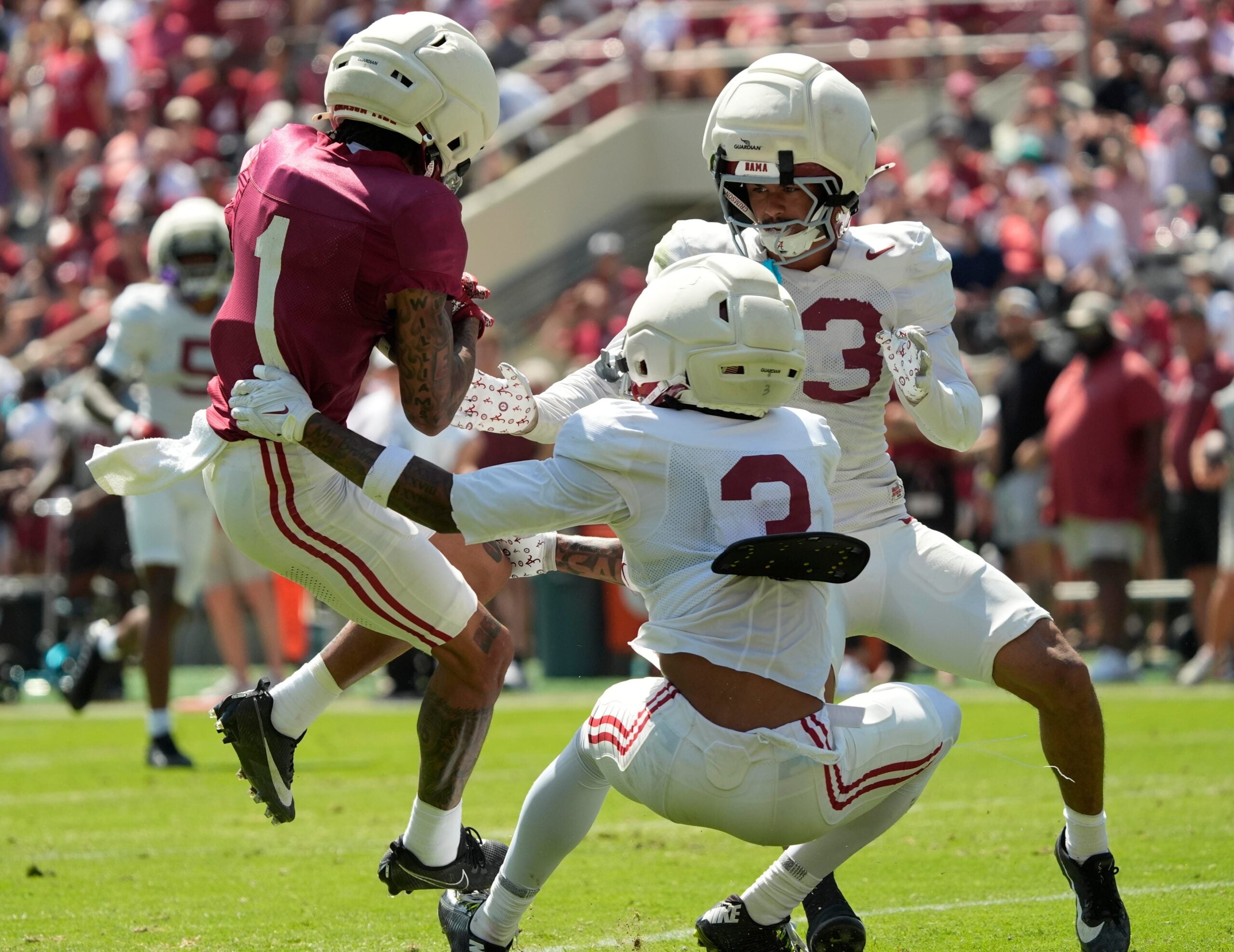 April 11, 2026; Tuscaloosa, AL, USA; Alabama Crimson Tide wide receiver Ryan Coleman-Williams (1) makes a catch as he is defended by Alabama Crimson Tide defensive back Keon Sabb (3) and Alabama Crimson Tide defensive back Ivan Taylor (13) at Bryant-Denny Stadium during the Alabama A Day scrimmage.