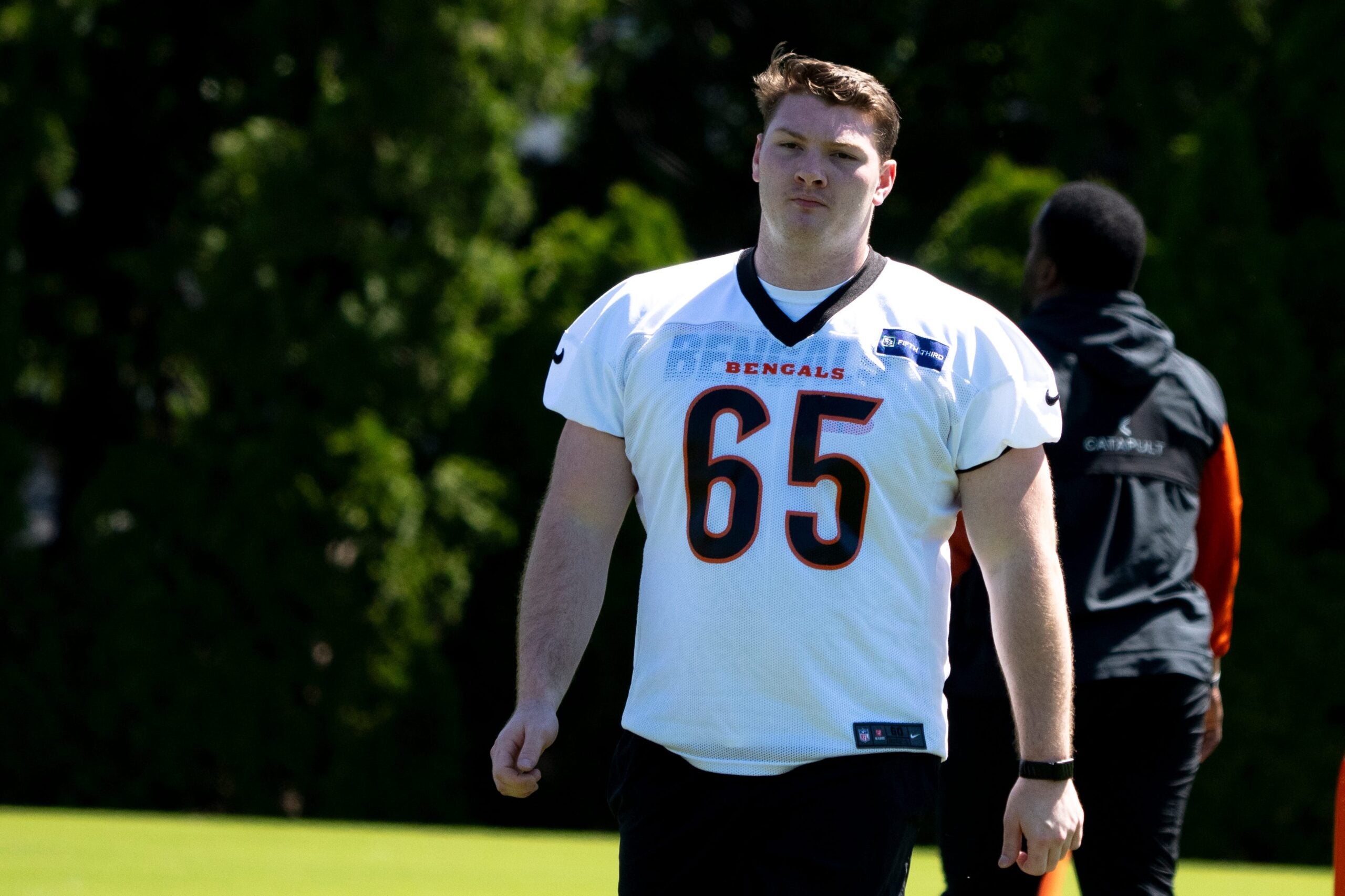 Cincinnati Bengals center Connor Lew (65) walks during a practice session at the Kettering Health Practice Fields in Cincinnati on Tuesday, May 12, 2026.