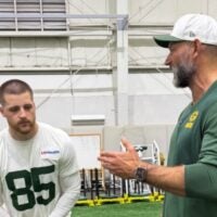 Packers tight end Tucker Kraft and Pro Football Hall of Famer Joe Thomas talked during a practice at the Don Hutson Center in Green Bay.