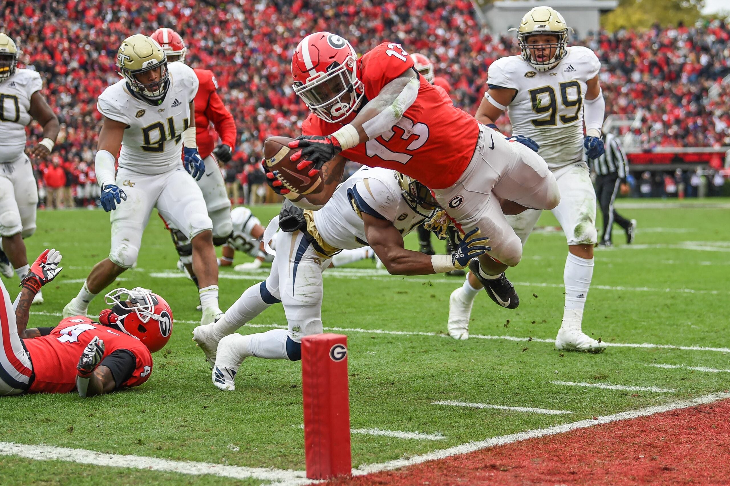 Nov 24, 2018; Athens, GA, USA; Georgia Bulldogs running back Elijah Holyfield (13) dives for a touchdown against the Georgia Tech Yellow Jackets during the first half at Sanford Stadium.