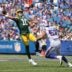 Packers quarterback Jordan Love tries to throw the ball away as he is pressured by Bills A.J. Epenesa. The pass was intercepted n the end zone by Micah Hyde.