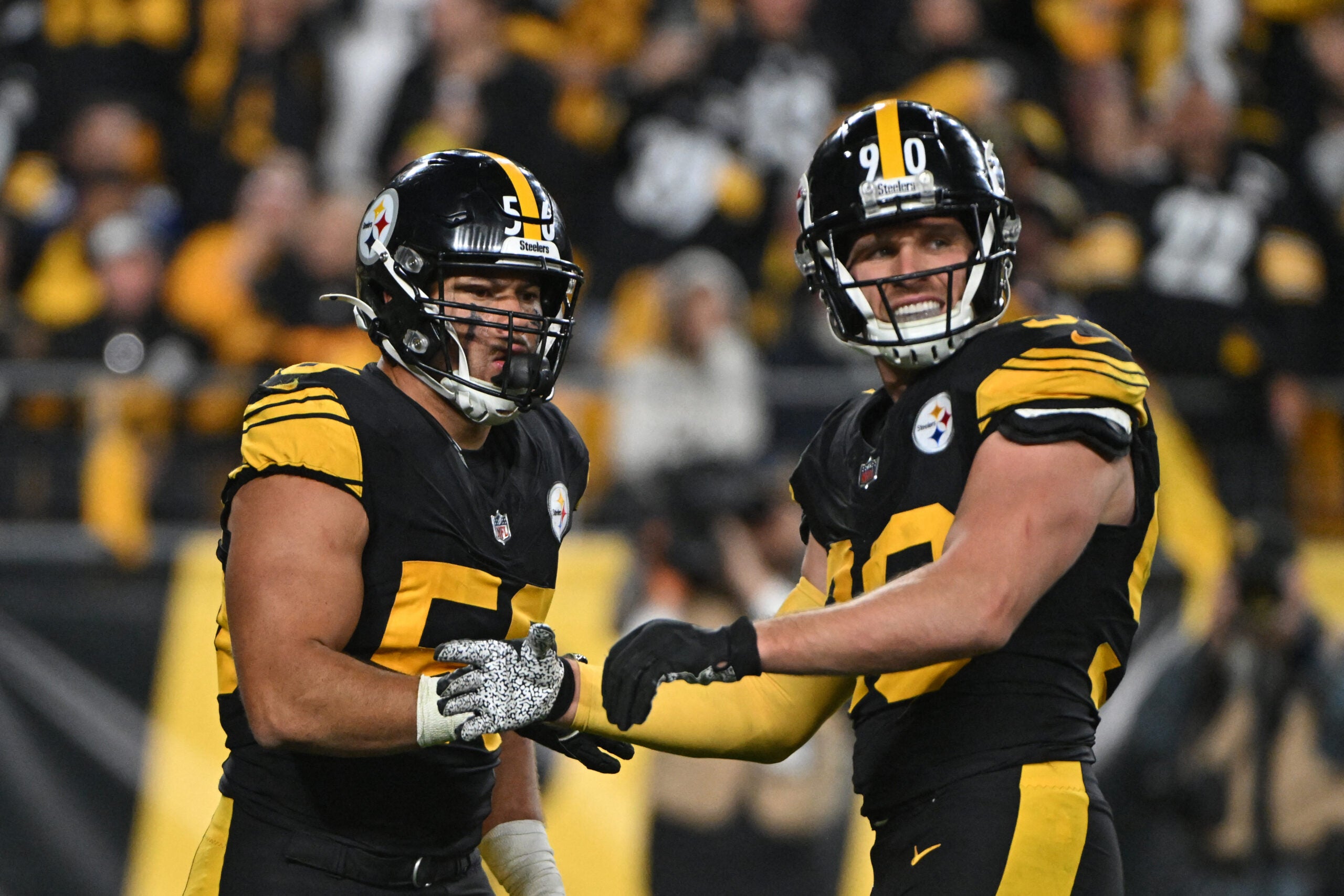 Oct 28, 2024; Pittsburgh, Pennsylvania, USA; Pittsburgh Steelers linebacker Alex Highsmith (56) celebrates with T.J. Watt (90) after sacking New York Giants quarterback Daniel Jones (8) during the third quarter at Acrisure Stadium.