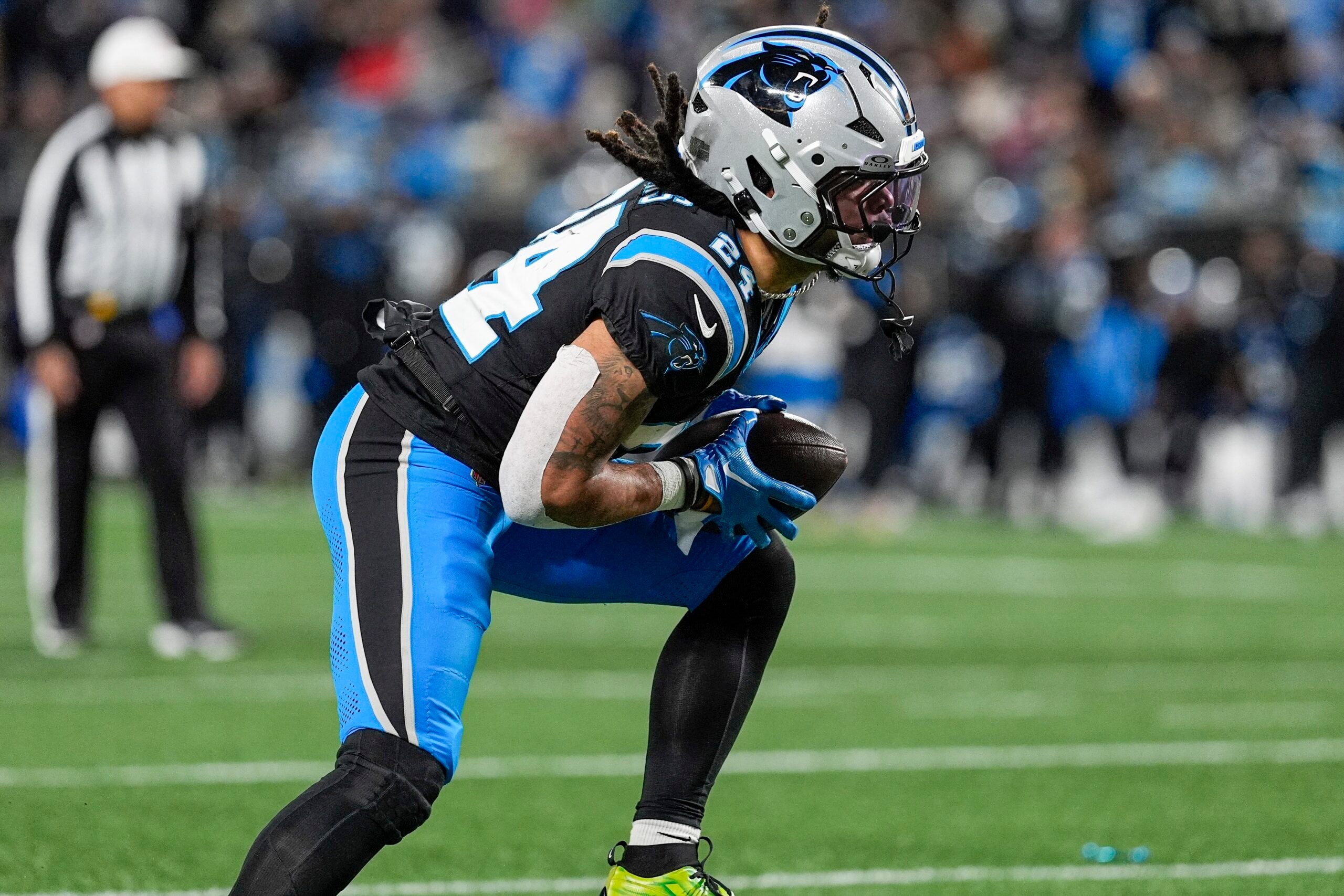 Dec 1, 2024; Charlotte, North Carolina, USA; Carolina Panthers running back Jonathon Brooks (24) runs for yardage against the Tampa Bay Buccaneers during the second half at Bank of America Stadium.