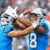 Aug 8, 2025; Charlotte, North Carolina, USA; Carolina Panthers wide receiver Jalen Coker (18) celebrates with quarterback Bryce Young (9) after a touchdown catch in the first quarter at Bank of America Stadium.