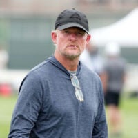 Aug 14, 2025; Carson, CA, USA; Los Angeles Rams general manager Les Snead watches during a joint practice against the New Orleans Saints at the Dignity Health Sports Park.
