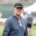 Aug 14, 2025; Carson, CA, USA; Los Angeles Rams general manager Les Snead watches during a joint practice against the New Orleans Saints at the Dignity Health Sports Park.