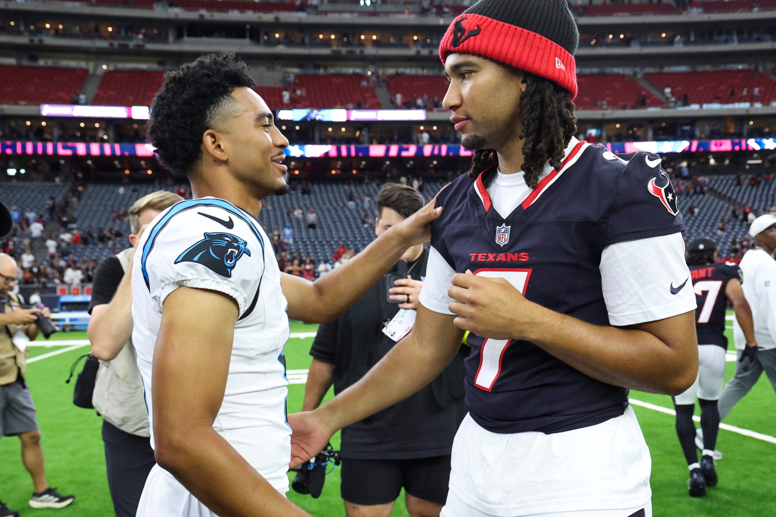 Aug 16, 2025; Houston, Texas, USA; Carolina Panthers quarterback Bryce Young (9) and Houston Texans quarterback C.J. Stroud (7) greet on the field after the game at NRG Stadium.